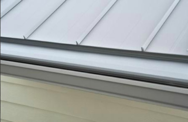 Metal roof with gutters.